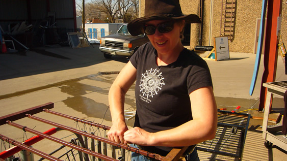 Jane making recycled instruments at Resource Yard